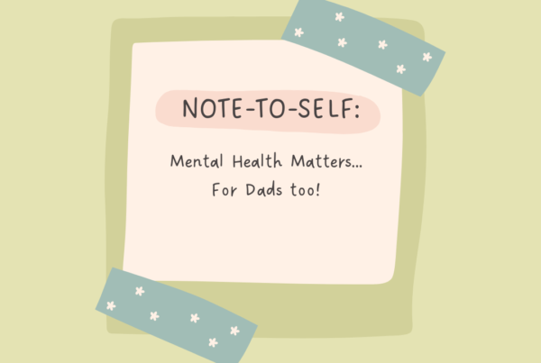 Text: Note-to-self: Mental Health Matters... For Dads too! Image: Beige note with green border; taped to light green background, with two pieces of blue tape with white polka dots. The tape is on the top right and bottom left corners of the note.